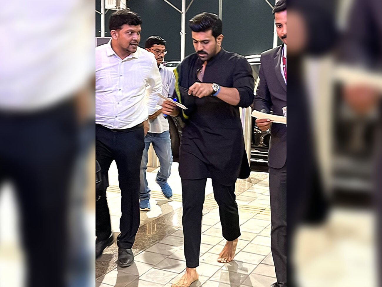 Headed To LA For The Oscars, Ram Charan Spotted Barefoot At Hyderabad Airport