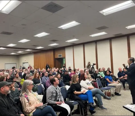 Raja-Krishnamoorthi-Faces-A-Packed-Town-Hall.webp