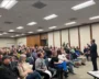 Raja-Krishnamoorthi-Faces-A-Packed-Town-Hall.webp