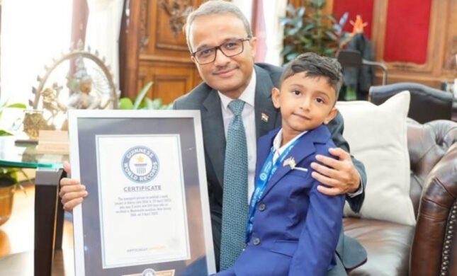 Four-year-old New Jersey author Advay Jain holds his book Dino Learns Not To Waste Food after setting a Guinness World Record.