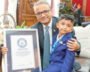 Four-year-old New Jersey author Advay Jain holds his book Dino Learns Not To Waste Food after setting a Guinness World Record.