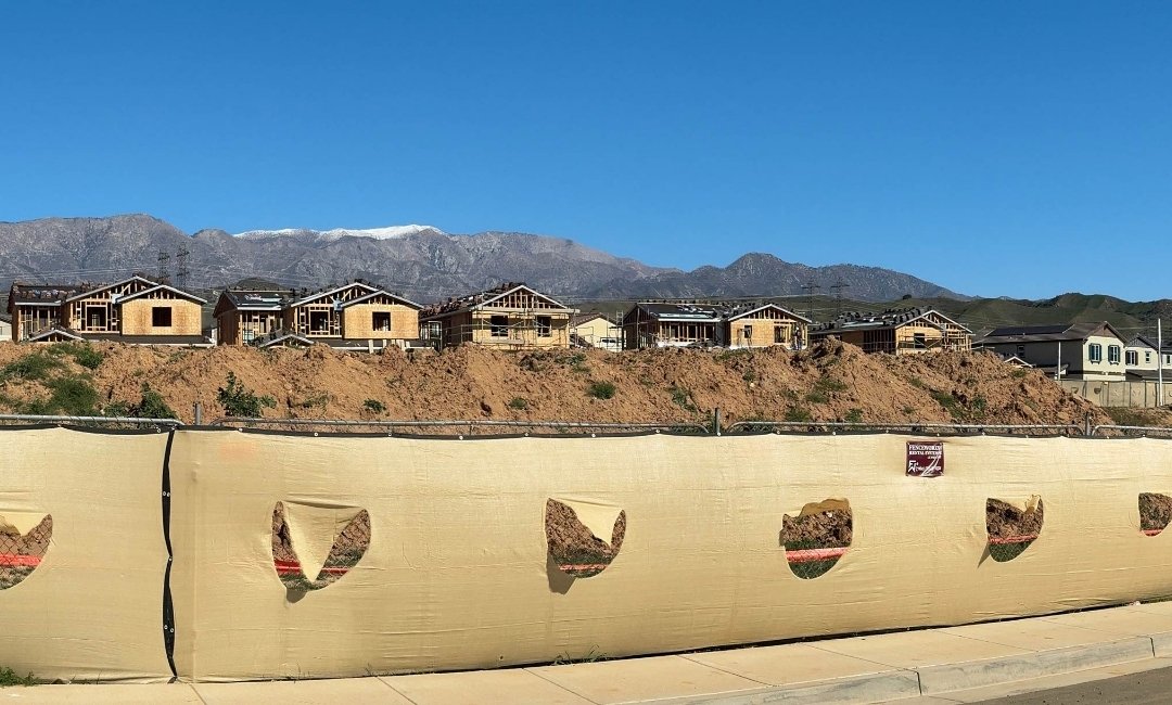 Urban development bordering farmland and open space in California