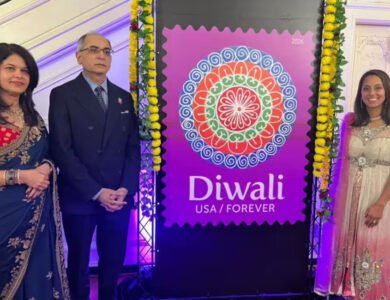 USPS Diwali Forever stamp featuring a colorful rangoli against a purple background