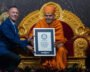 Mahant Swami Maharaj receives the Guinness World Records certificate for the 13-volume biography of Pramukh Swami Maharaj.