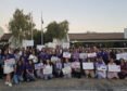 Community members gather for a domestic violence awareness candlelight vigil in Fremont
