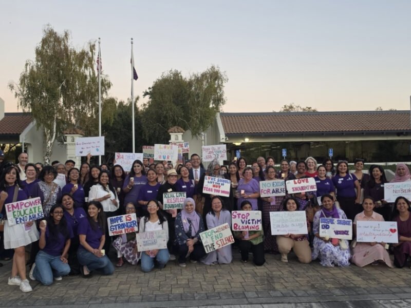 Community members gather for a domestic violence awareness candlelight vigil in Fremont