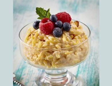 Indian rice pudding topped with shaved dark chocolate, berries and slivered almonds